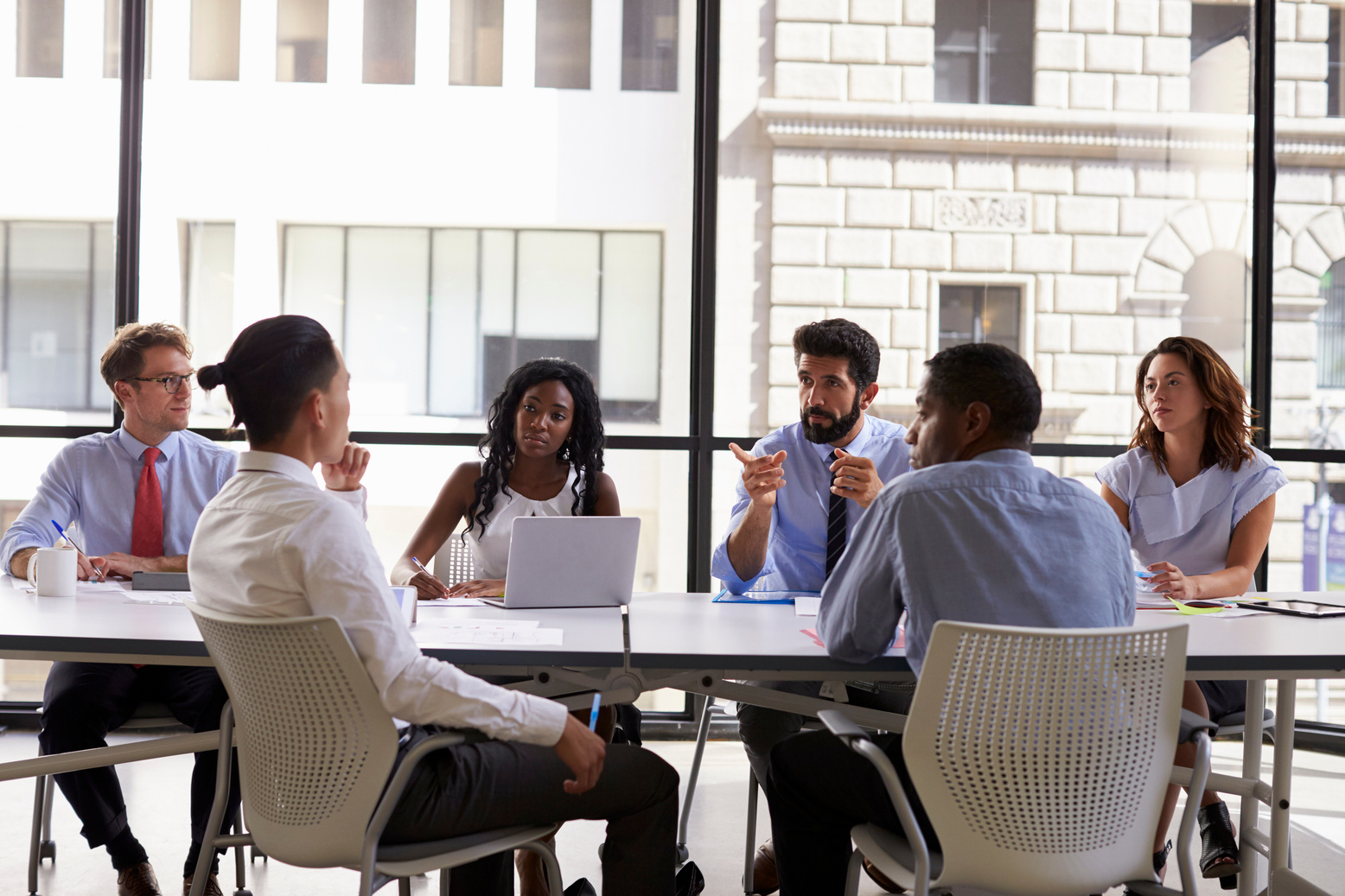 Manager Talks to Business Colleagues 